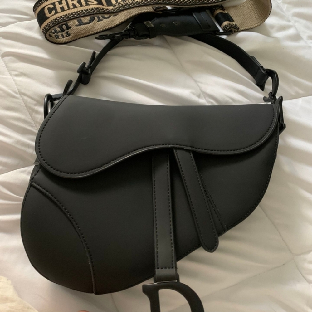 Dior black ultramatte saddle bag.